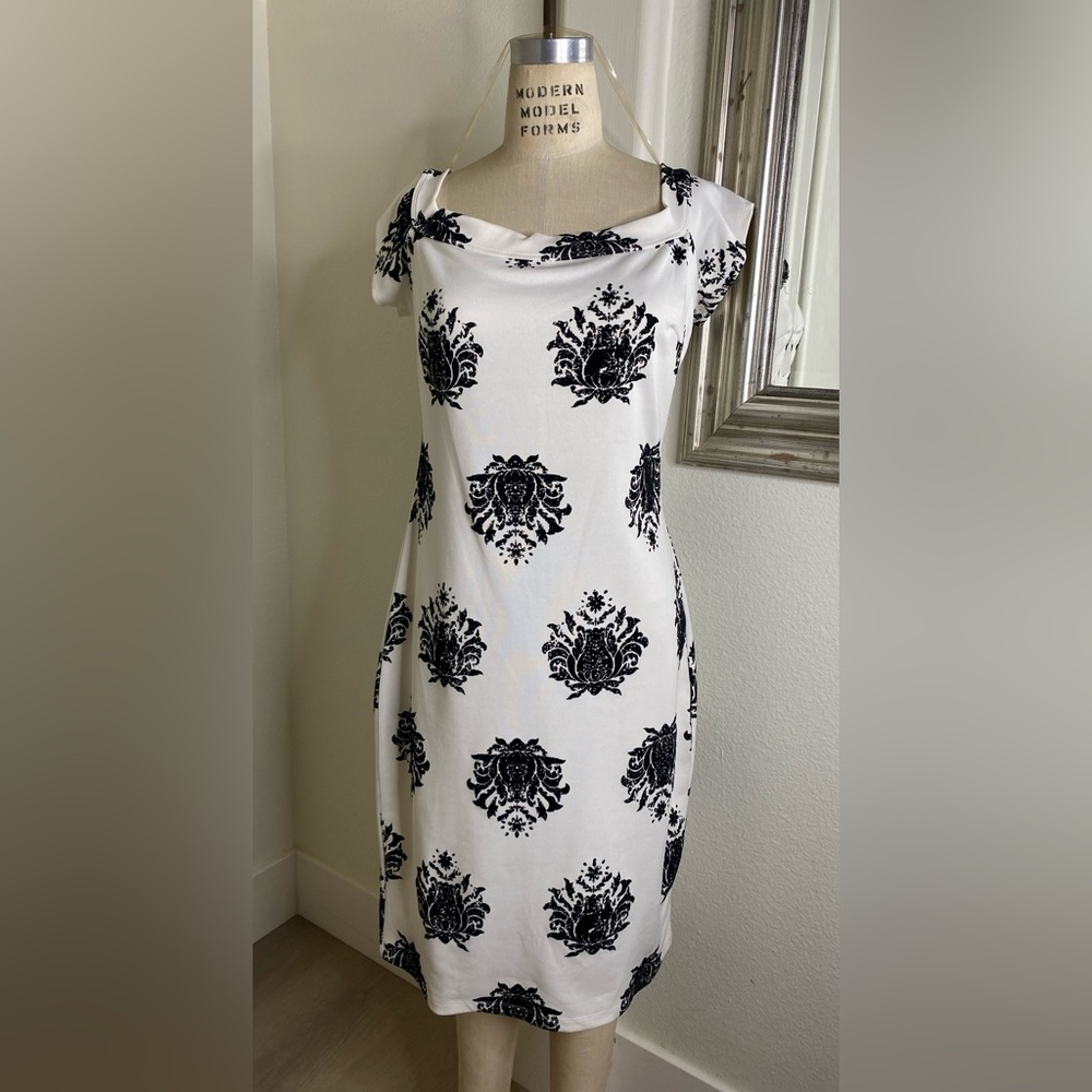 White dress with black embossed roses